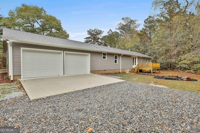 exterior space with a deck and a garage