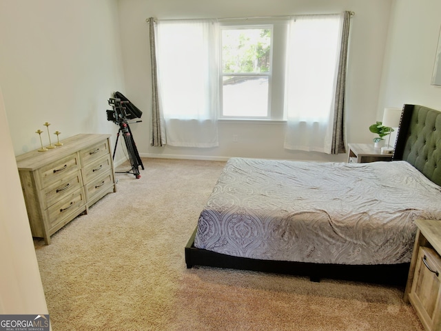 bedroom with light carpet