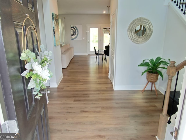 hall with light wood-type flooring