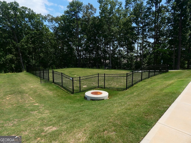 view of yard with an outdoor fire pit