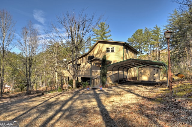 view of home's exterior featuring a shed and a carport