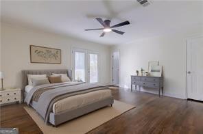 bedroom with dark hardwood / wood-style flooring and ceiling fan