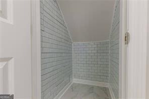 bathroom with vaulted ceiling