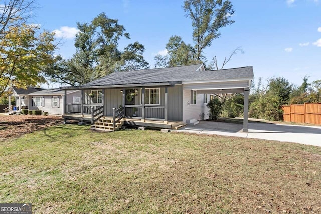 18 Watson Dr, Newnan, GA 30263 - view of front facade with an attached carport, driveway, and board and batten siding
