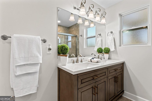 18 Watson Dr, Newnan, GA 30263 - bathroom featuring double vanity, a shower stall, and baseboards