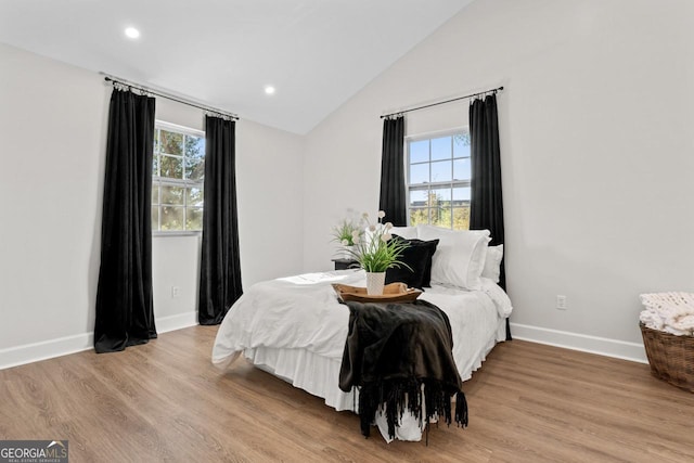 18 Watson Dr, Newnan, GA 30263 - bedroom featuring multiple windows, baseboards, lofted ceiling, light wood-type flooring, and recessed lighting