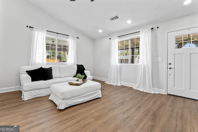 18 Watson Dr, Newnan, GA 30263 - living room with wood finished floors, lofted ceiling, baseboards, and recessed lighting