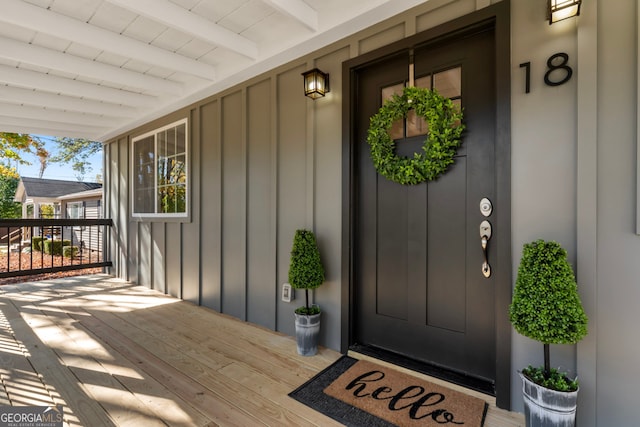 doorway to property featuring a porch