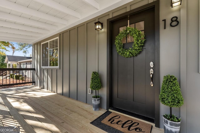 18 Watson Dr, Newnan, GA 30263 - property entrance with board and batten siding and a porch