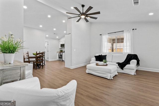 18 Watson Dr, Newnan, GA 30263 - living room with ceiling fan, baseboards, light wood finished floors, recessed lighting, and high vaulted ceiling