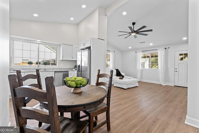 18 Watson Dr, Newnan, GA 30263 - dining space featuring light wood finished floors, recessed lighting, a ceiling fan, baseboards, and high vaulted ceiling