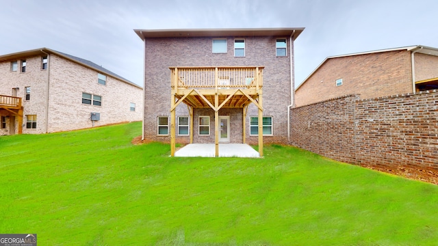 rear view of property featuring a lawn and a patio