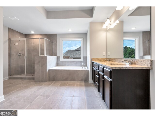 bathroom featuring tile patterned floors, vanity, and independent shower and bath