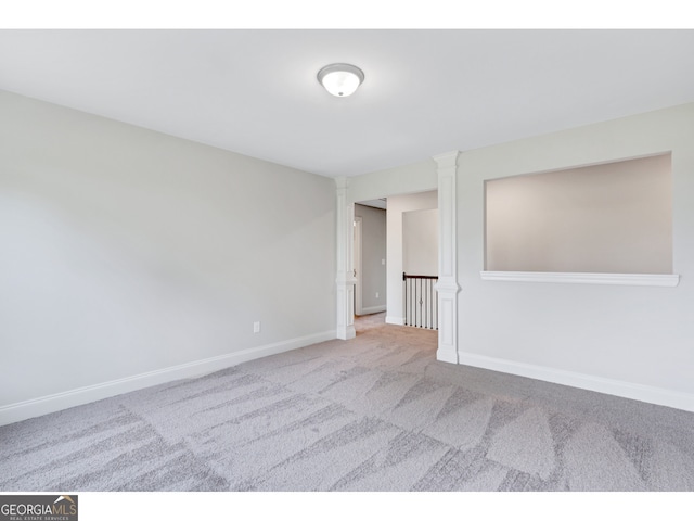 empty room featuring light carpet