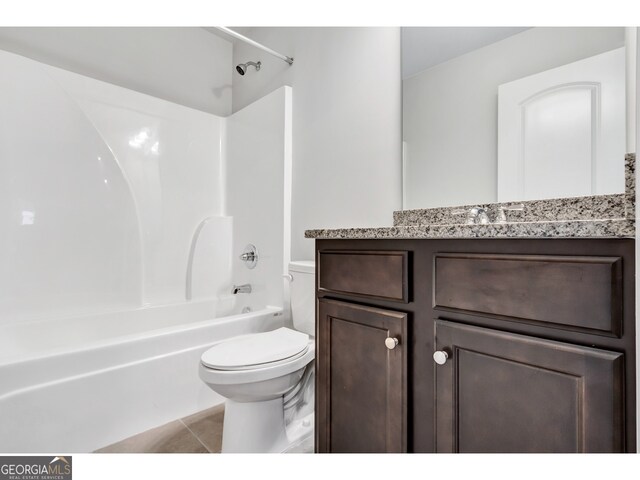 full bathroom with tile patterned flooring, shower / tub combination, vanity, and toilet