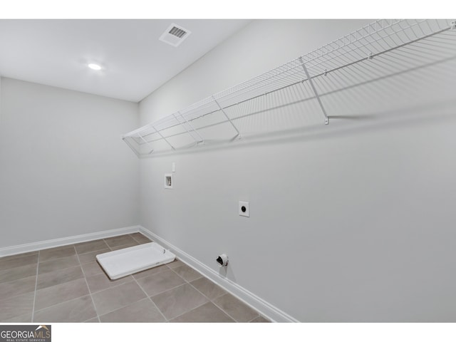 washroom featuring electric dryer hookup, tile patterned floors, and hookup for a washing machine