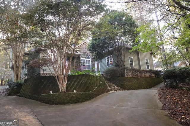 view of property hidden behind natural elements