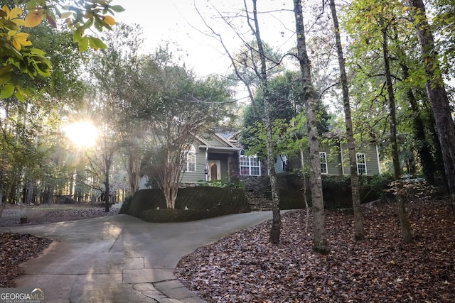 view of property hidden behind natural elements