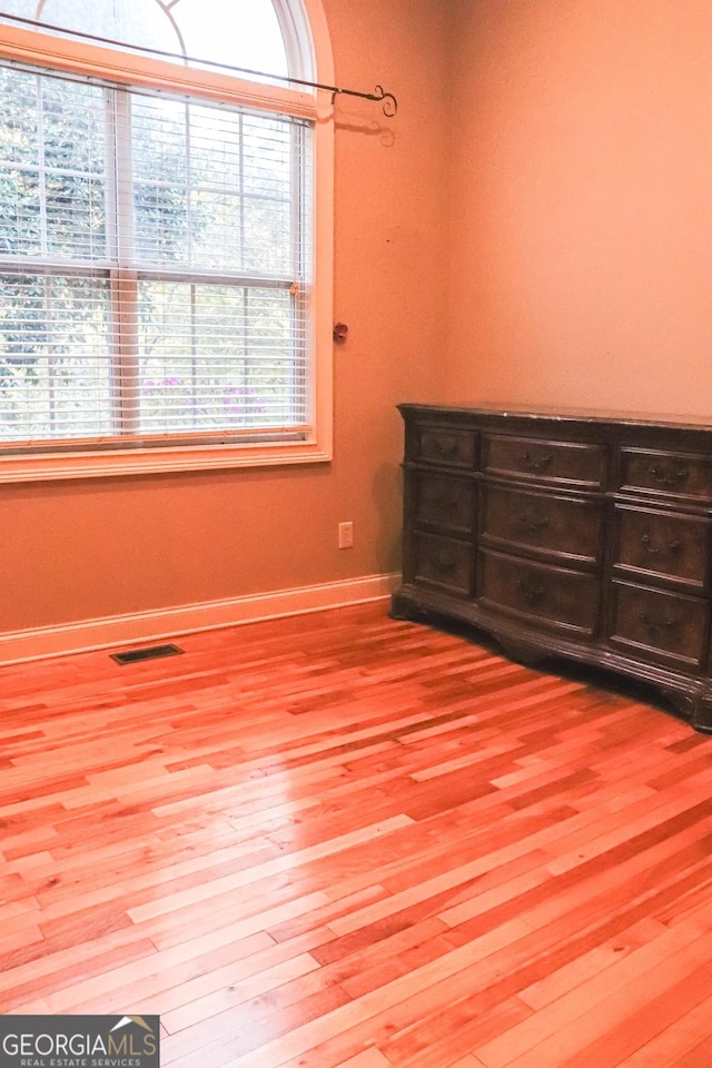 unfurnished bedroom featuring wood-type flooring