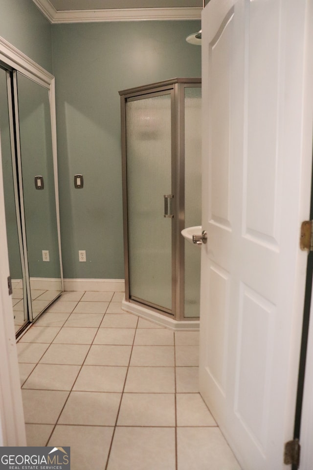 bathroom featuring tile patterned floors and ornamental molding