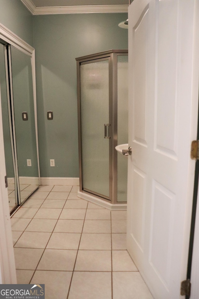 bathroom with tile patterned floors and ornamental molding