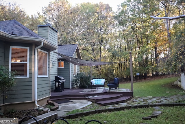 view of yard featuring a wooden deck and an outdoor living space