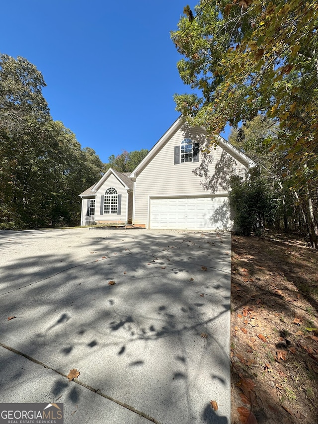 view of property exterior with a garage