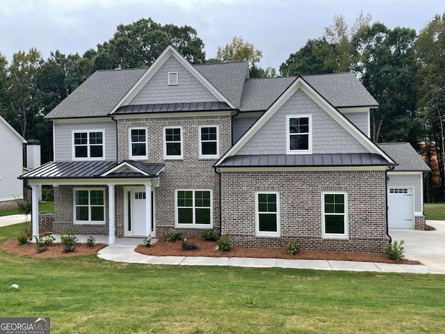 craftsman-style home featuring a garage and a front yard