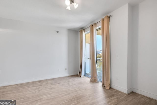 unfurnished room featuring light wood-type flooring