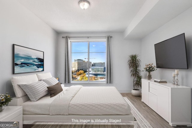 bedroom featuring hardwood / wood-style flooring