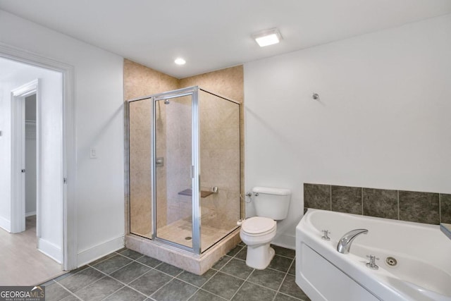 bathroom featuring plus walk in shower, tile patterned flooring, and toilet