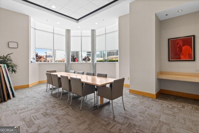 dining room with carpet flooring and a healthy amount of sunlight