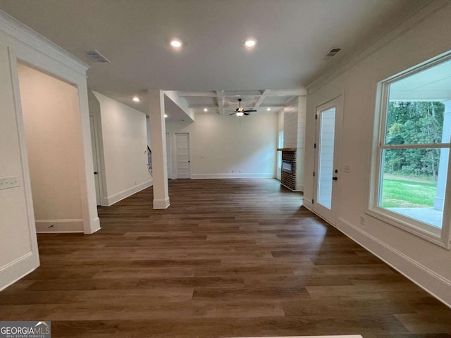 interior space featuring a wealth of natural light, ceiling fan, and dark hardwood / wood-style floors