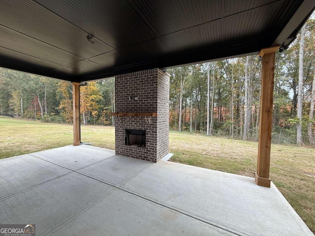 view of patio / terrace featuring an outdoor brick fireplace