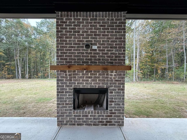 view of patio / terrace with an outdoor brick fireplace