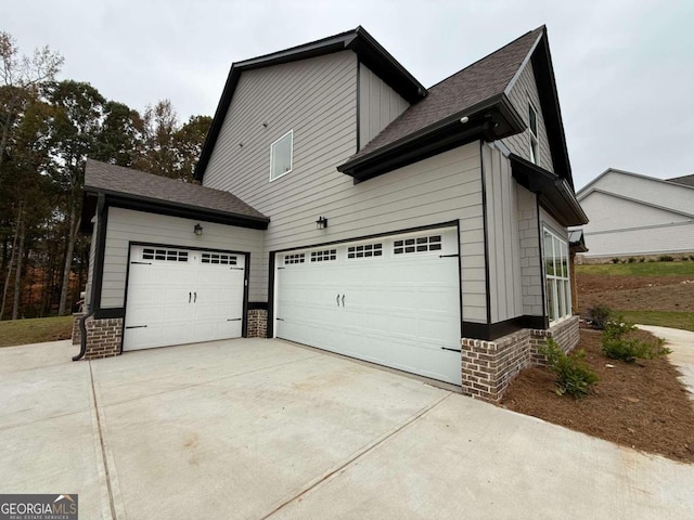 view of side of property with a garage