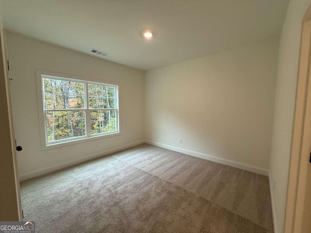 view of carpeted spare room