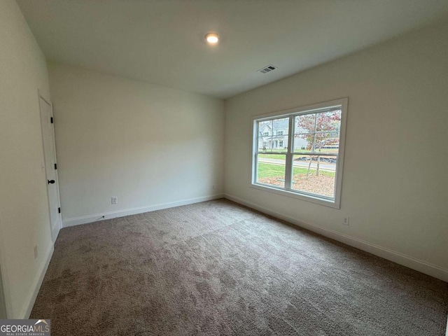 empty room with carpet flooring