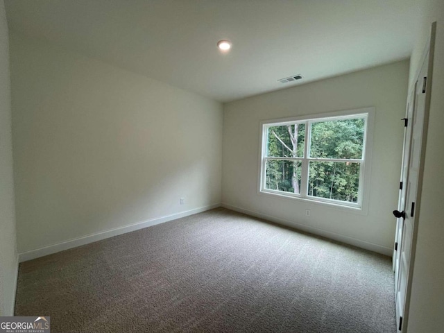 view of carpeted spare room