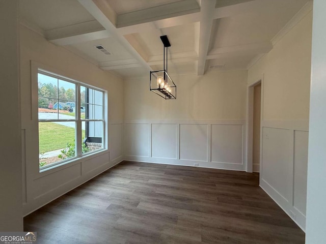 unfurnished dining area with beam ceiling, coffered ceiling, a notable chandelier, crown molding, and wood-type flooring