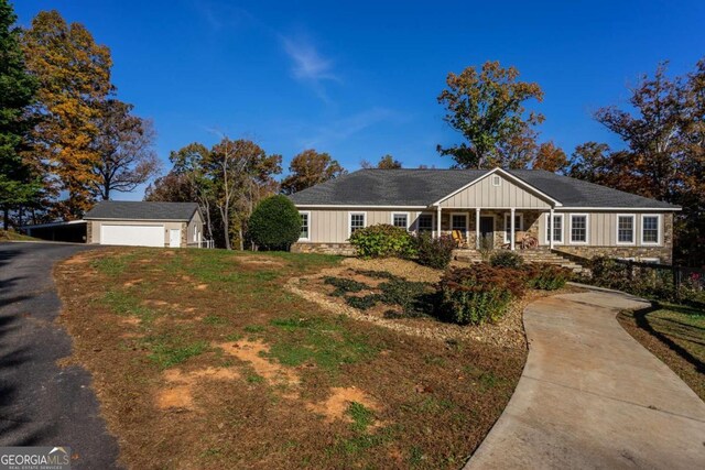 ranch-style house with an outbuilding and a garage