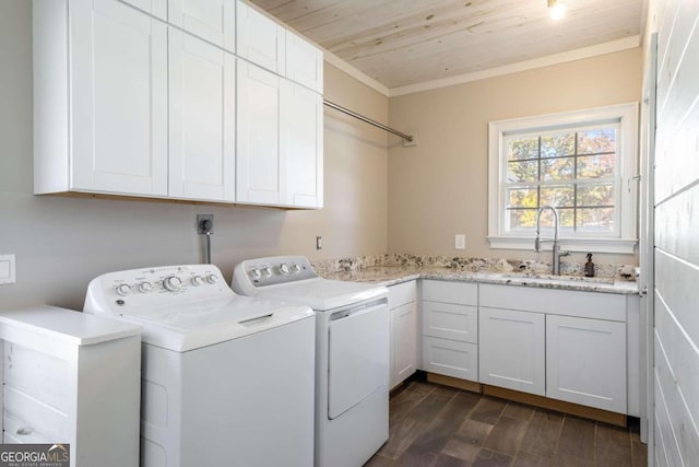 laundry area with cabinets, dark hardwood / wood-style flooring, ornamental molding, separate washer and dryer, and wooden ceiling