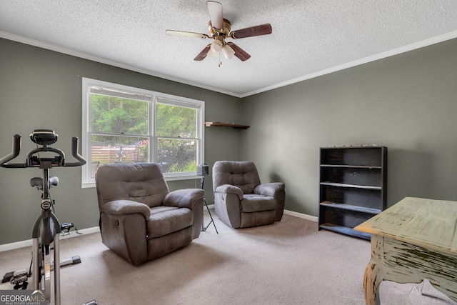 living area featuring ceiling fan, light colored carpet, and a textured ceiling