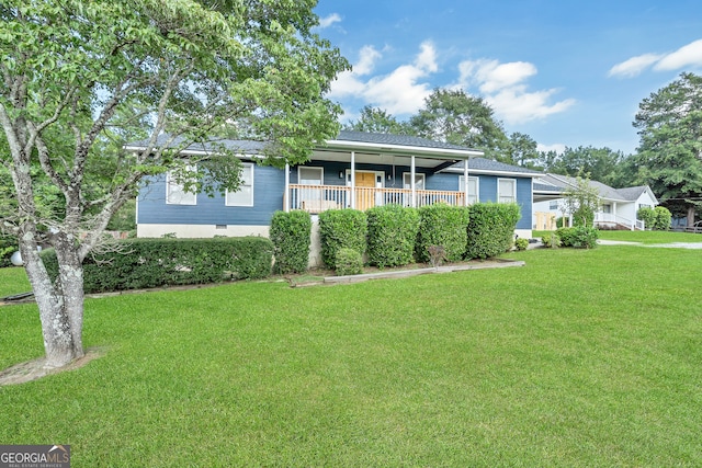 ranch-style house featuring a porch and a front lawn