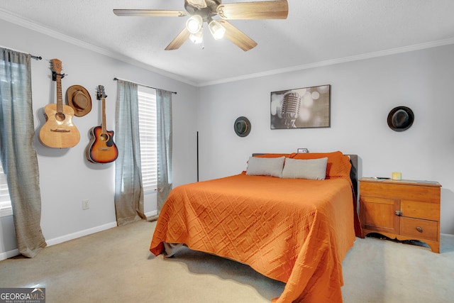 carpeted bedroom with a textured ceiling, ceiling fan, and crown molding