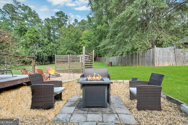 view of patio / terrace featuring a fire pit