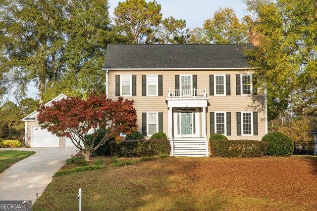 colonial home featuring a balcony