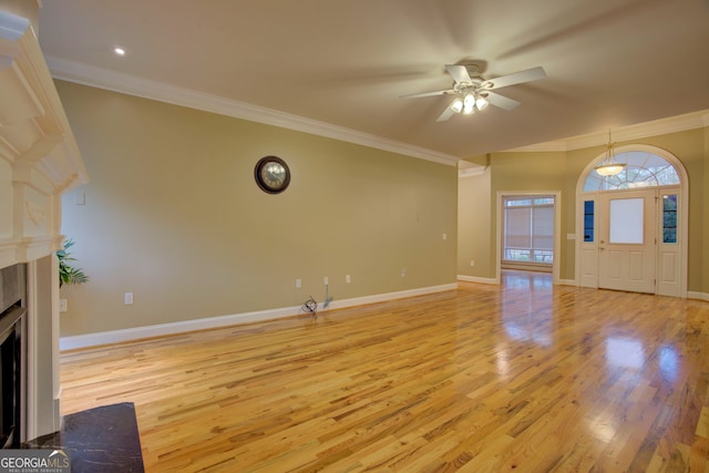 unfurnished living room with ceiling fan, light hardwood / wood-style floors, and ornamental molding