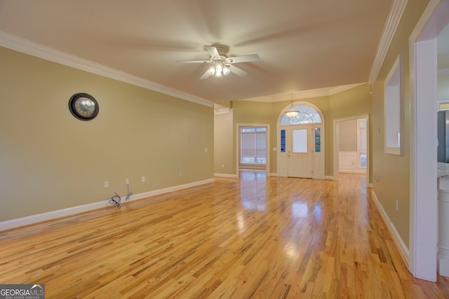 unfurnished living room with light hardwood / wood-style flooring, ceiling fan, and ornamental molding