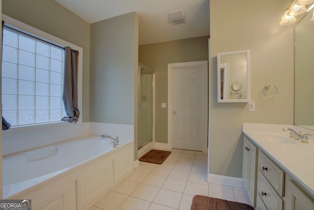 bathroom featuring a wealth of natural light, tile patterned flooring, vanity, and shower with separate bathtub